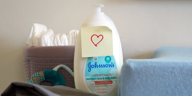 Johnson’s® CottonTouch™ newborn lotion with a heart sticker