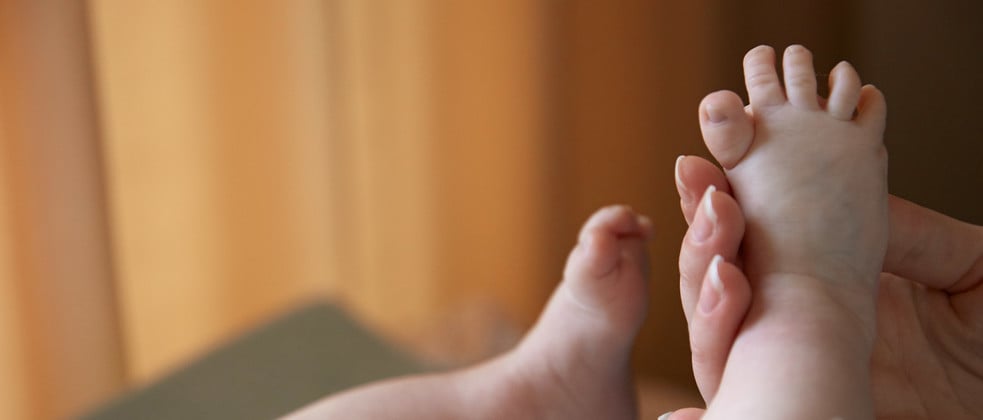 Newborn massage on feet